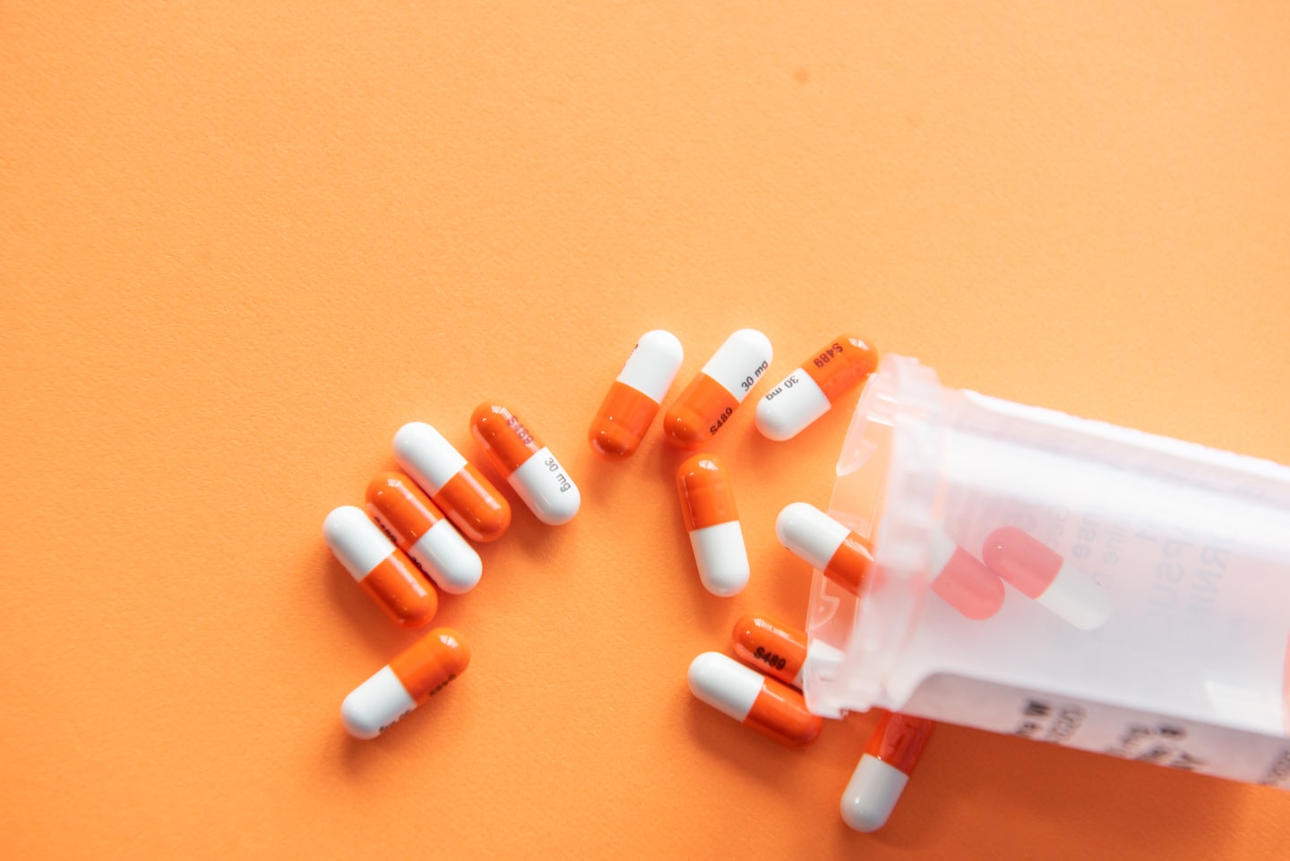 Capsules spilling from a bottle